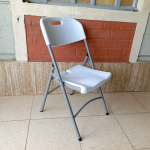 foldable white grey chair, white grey folding chair, collapsible white chair, grey and white foldable chair, portable folding chair, space-saving foldable chair, compact white chair, modern folding chair, plastic folding chair white grey, grey white folding event chair, lightweight foldable chair, foldable chair for office, white grey camping chair, white grey conference chair, folding chair with two-tone color, indoor foldable chair, outdoor folding chair, white grey folding seat, stackable folding chair, minimal folding chair design, stylish white grey chair, training room foldable chair, white grey visitor chair, plastic fold-up chair, foldable dining chair white grey