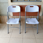 foldable white grey chair, white grey folding chair, collapsible white chair, grey and white foldable chair, portable folding chair, space-saving foldable chair, compact white chair, modern folding chair, plastic folding chair white grey, grey white folding event chair, lightweight foldable chair, foldable chair for office, white grey camping chair, white grey conference chair, folding chair with two-tone color, indoor foldable chair, outdoor folding chair, white grey folding seat, stackable folding chair, minimal folding chair design, stylish white grey chair, training room foldable chair, white grey visitor chair, plastic fold-up chair, foldable dining chair white grey