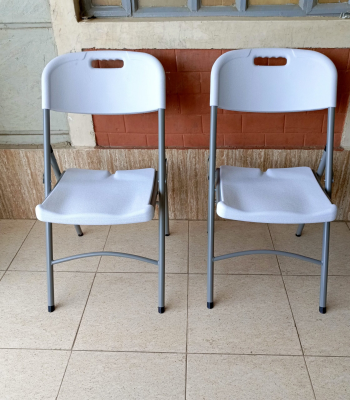 foldable white grey chair, white grey folding chair, collapsible white chair, grey and white foldable chair, portable folding chair, space-saving foldable chair, compact white chair, modern folding chair, plastic folding chair white grey, grey white folding event chair, lightweight foldable chair, foldable chair for office, white grey camping chair, white grey conference chair, folding chair with two-tone color, indoor foldable chair, outdoor folding chair, white grey folding seat, stackable folding chair, minimal folding chair design, stylish white grey chair, training room foldable chair, white grey visitor chair, plastic fold-up chair, foldable dining chair white grey