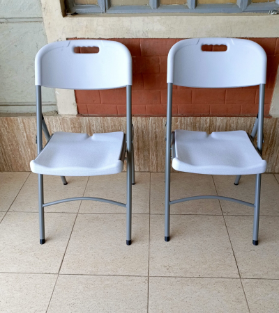 foldable white grey chair, white grey folding chair, collapsible white chair, grey and white foldable chair, portable folding chair, space-saving foldable chair, compact white chair, modern folding chair, plastic folding chair white grey, grey white folding event chair, lightweight foldable chair, foldable chair for office, white grey camping chair, white grey conference chair, folding chair with two-tone color, indoor foldable chair, outdoor folding chair, white grey folding seat, stackable folding chair, minimal folding chair design, stylish white grey chair, training room foldable chair, white grey visitor chair, plastic fold-up chair, foldable dining chair white grey