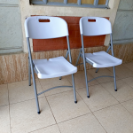 foldable white grey chair, white grey folding chair, collapsible white chair, grey and white foldable chair, portable folding chair, space-saving foldable chair, compact white chair, modern folding chair, plastic folding chair white grey, grey white folding event chair, lightweight foldable chair, foldable chair for office, white grey camping chair, white grey conference chair, folding chair with two-tone color, indoor foldable chair, outdoor folding chair, white grey folding seat, stackable folding chair, minimal folding chair design, stylish white grey chair, training room foldable chair, white grey visitor chair, plastic fold-up chair, foldable dining chair white grey
