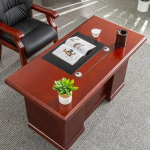 Mahogany CEO Office Desk – Command Presence with Timeless Elegance Make a bold statement in your executive suite with the Mahogany CEO Office Desk, designed to reflect authority, sophistication, and prestige. Crafted with rich mahogany wood finishes and premium construction, this desk is more than just a workstation—it’s a symbol of leadership and refined taste. With an expansive surface, elegant detailing, and integrated storage, it offers unmatched functionality while enhancing the visual grandeur of your office. Whether used in a corporate boardroom or a luxury home office, this desk commands attention and delivers performance. Key Features & Benefits ✅ Rich Mahogany Finish – Classic wood tones that exude elegance and professionalism ✅ Spacious Work Surface – Ideal for documents, computers, décor, and meetings ✅ Integrated Storage Options – Includes drawers, cabinets, or side returns for organization ✅ High-End Craftsmanship – Built with solid wood, veneer, or high-grade MDF for durability ✅ Cable Management Ports – Keep cords hidden for a clean, executive look ✅ Ornate Design Accents – Includes beveled edges, panel details, or chrome/metal trims ✅ Scratch & Stain Resistant – Finished for long-term use and easy maintenance ✅ Optional L-Shape or U-Shape Configuration – Customize based on office layout Ideal For: CEOs, directors, and senior executives Luxury home offices Boardrooms and professional suites Law firms, financial institutions, and consultancies