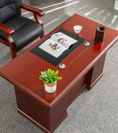 Mahogany CEO Office Desk – Command Presence with Timeless Elegance Make a bold statement in your executive suite with the Mahogany CEO Office Desk, designed to reflect authority, sophistication, and prestige. Crafted with rich mahogany wood finishes and premium construction, this desk is more than just a workstation—it’s a symbol of leadership and refined taste. With an expansive surface, elegant detailing, and integrated storage, it offers unmatched functionality while enhancing the visual grandeur of your office. Whether used in a corporate boardroom or a luxury home office, this desk commands attention and delivers performance. Key Features & Benefits ✅ Rich Mahogany Finish – Classic wood tones that exude elegance and professionalism ✅ Spacious Work Surface – Ideal for documents, computers, décor, and meetings ✅ Integrated Storage Options – Includes drawers, cabinets, or side returns for organization ✅ High-End Craftsmanship – Built with solid wood, veneer, or high-grade MDF for durability ✅ Cable Management Ports – Keep cords hidden for a clean, executive look ✅ Ornate Design Accents – Includes beveled edges, panel details, or chrome/metal trims ✅ Scratch & Stain Resistant – Finished for long-term use and easy maintenance ✅ Optional L-Shape or U-Shape Configuration – Customize based on office layout Ideal For: CEOs, directors, and senior executives Luxury home offices Boardrooms and professional suites Law firms, financial institutions, and consultancies