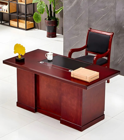 Mahogany CEO Office Desk – Command Presence with Timeless Elegance Make a bold statement in your executive suite with the Mahogany CEO Office Desk, designed to reflect authority, sophistication, and prestige. Crafted with rich mahogany wood finishes and premium construction, this desk is more than just a workstation—it’s a symbol of leadership and refined taste. With an expansive surface, elegant detailing, and integrated storage, it offers unmatched functionality while enhancing the visual grandeur of your office. Whether used in a corporate boardroom or a luxury home office, this desk commands attention and delivers performance. Key Features & Benefits ✅ Rich Mahogany Finish – Classic wood tones that exude elegance and professionalism ✅ Spacious Work Surface – Ideal for documents, computers, décor, and meetings ✅ Integrated Storage Options – Includes drawers, cabinets, or side returns for organization ✅ High-End Craftsmanship – Built with solid wood, veneer, or high-grade MDF for durability ✅ Cable Management Ports – Keep cords hidden for a clean, executive look ✅ Ornate Design Accents – Includes beveled edges, panel details, or chrome/metal trims ✅ Scratch & Stain Resistant – Finished for long-term use and easy maintenance ✅ Optional L-Shape or U-Shape Configuration – Customize based on office layout Ideal For: CEOs, directors, and senior executives Luxury home offices Boardrooms and professional suites Law firms, financial institutions, and consultancies