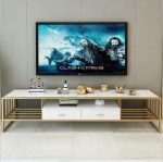 Modern Marble TV Console – Luxury Meets Functionality Enhance your living room with the Modern Marble TV Console, designed to combine elegance, durability, and modern functionality. Its marble finish adds a luxurious statement to any interior. Moreover, the sleek design creates a stylish focal point while keeping your entertainment area organized and clutter-free. Premium Marble Finish and Strong Build This TV console features a high-quality marble or marble-effect tabletop paired with a sturdy metal or engineered wood base. As a result, it offers excellent durability and long-term performance. Additionally, the scratch-resistant and heat-resistant surface ensures the console maintains its refined appearance even with daily use. Spacious and Practical Storage The Modern Marble TV Console provides ample storage for your entertainment essentials. It includes spacious cabinets, drawers, or open shelves for media devices, remote controls, books, and décor items. Furthermore, the wide tabletop comfortably supports flat-screen TVs while leaving room for decorative accents. Stylish and Contemporary Design With its clean lines and elegant marble finish, this TV console complements modern, contemporary, and luxury interiors. Moreover, the neutral tones blend seamlessly with different color schemes and furniture styles. This makes it suitable for living rooms, lounges, apartments, or executive spaces. Cable Management and Convenience Designed with practicality in mind, the console includes built-in cable management openings. These allow you to organize wires neatly and maintain a clean, polished look. In addition, the elevated base makes cleaning underneath easy, improving overall convenience. Easy Assembly and Low Maintenance Assembly is quick and straightforward, with clear instructions and fittings included. In addition, maintenance is effortless. Simply wipe the marble surface with a soft, damp cloth to remove dust or spills. This low-maintenance design saves time while preserving elegance. Why Choose Our Modern Marble TV Console? Luxurious marble finish for a premium look Durable construction for long-term use Spacious storage for media and accessories Built-in cable management for a tidy setup Modern, elegant design for stylish interiors Finally, the Modern Marble TV Console combines luxury, practicality, and durability, making it the perfect entertainment unit for modern homes that value both style and function.