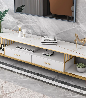 Modern Marble TV Console – Luxury Meets Functionality Enhance your living room with the Modern Marble TV Console, designed to combine elegance, durability, and modern functionality. Its marble finish adds a luxurious statement to any interior. Moreover, the sleek design creates a stylish focal point while keeping your entertainment area organized and clutter-free. Premium Marble Finish and Strong Build This TV console features a high-quality marble or marble-effect tabletop paired with a sturdy metal or engineered wood base. As a result, it offers excellent durability and long-term performance. Additionally, the scratch-resistant and heat-resistant surface ensures the console maintains its refined appearance even with daily use. Spacious and Practical Storage The Modern Marble TV Console provides ample storage for your entertainment essentials. It includes spacious cabinets, drawers, or open shelves for media devices, remote controls, books, and décor items. Furthermore, the wide tabletop comfortably supports flat-screen TVs while leaving room for decorative accents. Stylish and Contemporary Design With its clean lines and elegant marble finish, this TV console complements modern, contemporary, and luxury interiors. Moreover, the neutral tones blend seamlessly with different color schemes and furniture styles. This makes it suitable for living rooms, lounges, apartments, or executive spaces. Cable Management and Convenience Designed with practicality in mind, the console includes built-in cable management openings. These allow you to organize wires neatly and maintain a clean, polished look. In addition, the elevated base makes cleaning underneath easy, improving overall convenience. Easy Assembly and Low Maintenance Assembly is quick and straightforward, with clear instructions and fittings included. In addition, maintenance is effortless. Simply wipe the marble surface with a soft, damp cloth to remove dust or spills. This low-maintenance design saves time while preserving elegance. Why Choose Our Modern Marble TV Console? Luxurious marble finish for a premium look Durable construction for long-term use Spacious storage for media and accessories Built-in cable management for a tidy setup Modern, elegant design for stylish interiors Finally, the Modern Marble TV Console combines luxury, practicality, and durability, making it the perfect entertainment unit for modern homes that value both style and function.