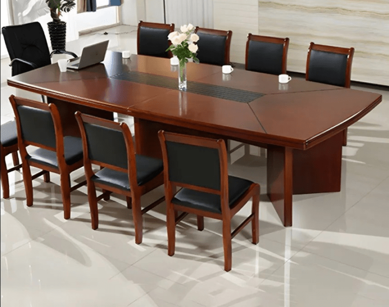 Gookenya office Boardroom Table Prices In kenya Elevate your meeting space with the Mahogany Office Boardroom Table, a sophisticated centerpiece designed for professionalism, durability, and timeless elegance. Perfect for boardrooms, conference rooms, and executive meeting areas, this table combines functionality with a luxurious mahogany finish that adds a touch of prestige to any office environment. Crafted from high-quality solid wood, this table is built to withstand daily use while maintaining its sleek, polished appearance. Its spacious surface accommodates multiple participants comfortably, making it ideal for collaborative meetings, presentations, and strategic discussions. The rich mahogany finish complements modern and classic office interiors, providing a professional yet stylish focal point in your workspace. Designed with both aesthetics and practicality in mind, the table features sturdy legs and reinforced construction, ensuring long-lasting stability and support. The smooth surface is easy to clean and maintain, offering a low-maintenance solution for busy offices. Its generous size allows for laptops, documents, and conference essentials without feeling cluttered, enhancing productivity and efficiency during meetings. Key Features: Material: Premium solid wood with a luxurious mahogany finish. Spacious Surface: Accommodates multiple participants comfortably for meetings. Durable Construction: Sturdy legs and reinforced frame for long-lasting stability. Elegant Design: Classic mahogany finish adds sophistication to any office space. Low Maintenance: Smooth surface is easy to clean and maintain. Professional & Stylish: Ideal for boardrooms, conference rooms, and executive offices. Versatile Use: Suitable for meetings, presentations, and collaborative discussions. Invest in the Mahogany Office Boardroom Table to create a professional and impressive meeting environment. Its combination of elegance, functionality, and durability ensures your boardroom or conference space makes a lasting impression while supporting productive and comfortable discussions.